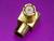A golden coaxial plug with a rectangular base on a purple background, showcasing a precise connection technology.