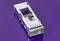 Metallic casing on a purple background, with a rectangular aperture and discernible grooves and edges.
