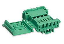 Green plastic connector with three openings for cable connections, set against a white background.