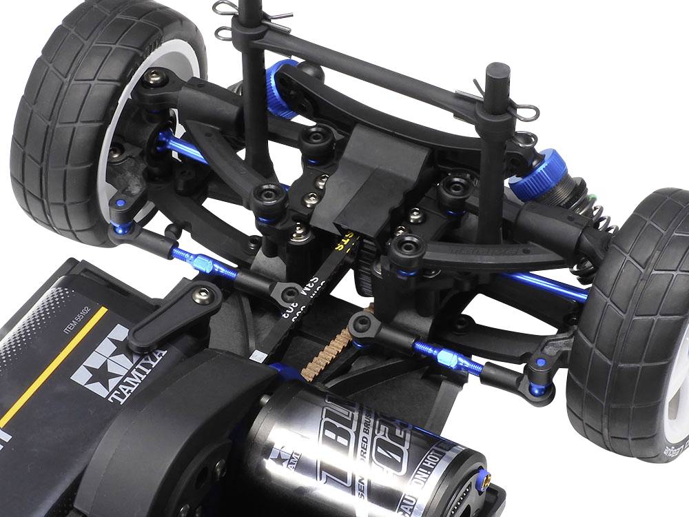 RC suspension from a bird's eye view, showing the front suspension system with blue shock absorbers and control arms.