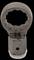 Metal component in crown shape with hexagonal opening, designed for technical or mechanical applications.