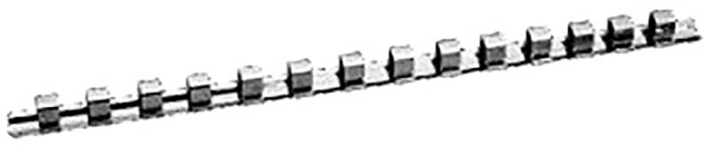 A white plastic comb binding spine in a comb shape, lying on a desk, used for holding together stacks of paper.