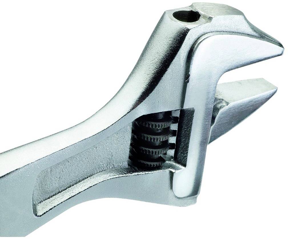 An adjustable spanner with a toothed adjustment screw, used for tightening or loosening bolts and nuts.