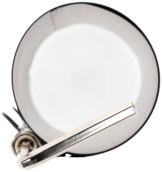 An empty, silver metal bucket, viewed from above.