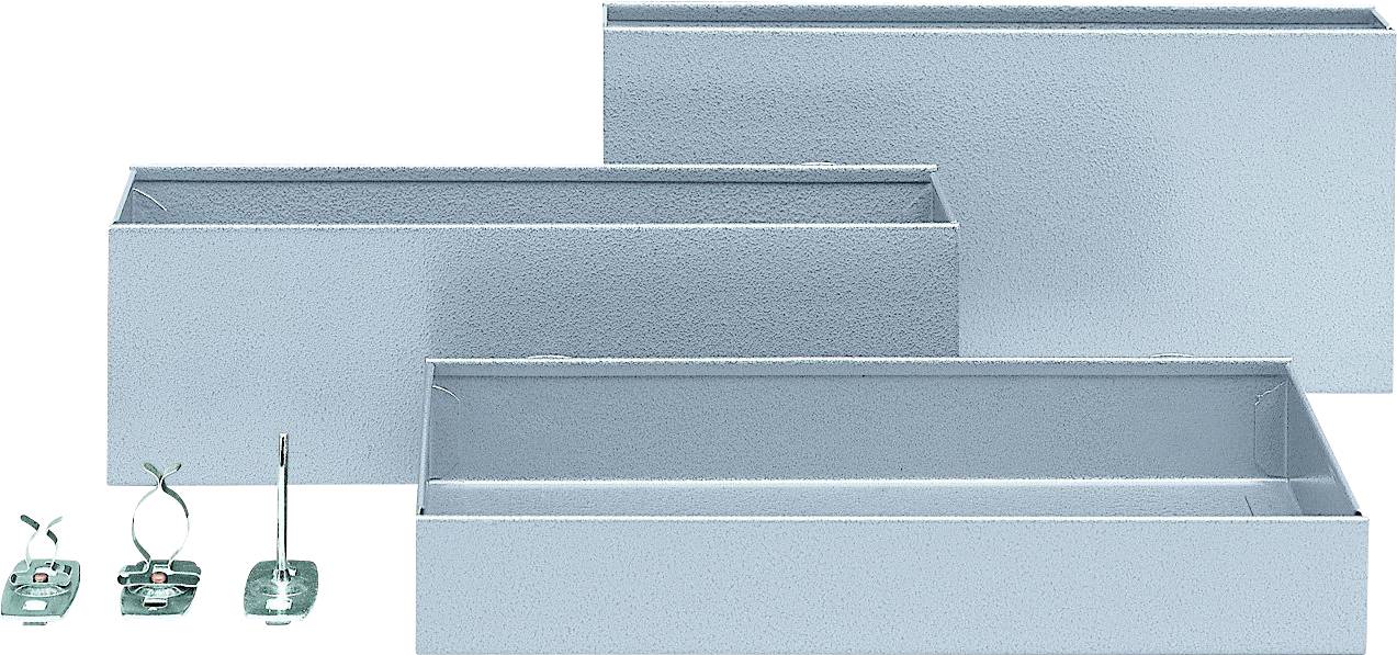 Three grey metal boxes of varying sizes, arranged side by side in the background, with two small metal accessories to the left.