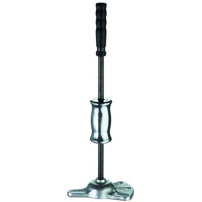A device with a long handle and metal base, likely a puller or vehicle repair tool, stands upright.