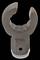 A brown, U-shaped tool with a corrugated inner surface and a hole at the base, possibly a gripping or clamping tool.