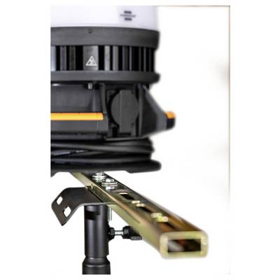 Close-up of a laser level mounted on a tripod, projecting a horizontal orange beam along a metal beam or rail.