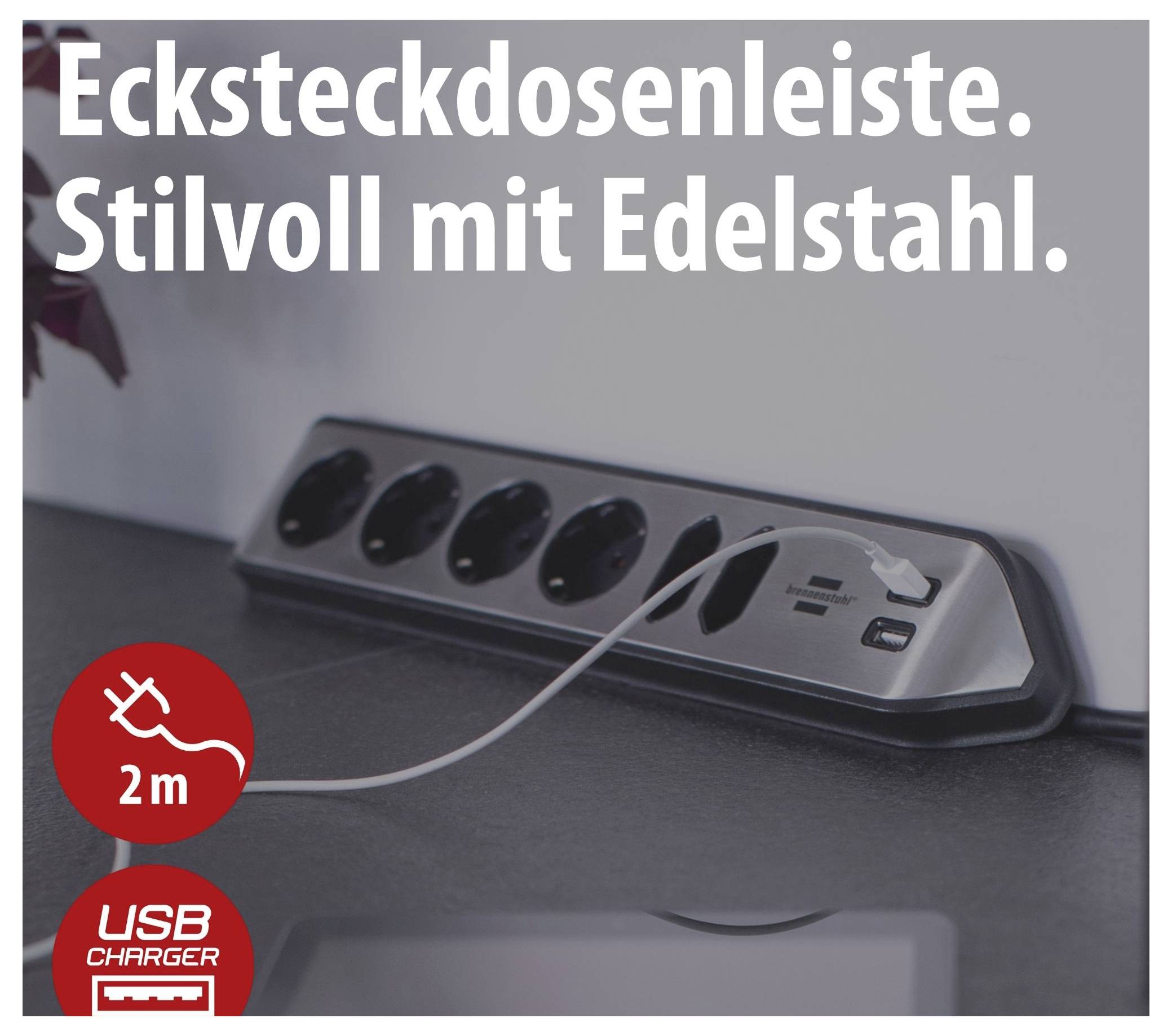 Corner power strip made of stainless steel with 2-metre cable and USB charging port; product photograph with the inscriptions 'Corner power strip. Stylish with stainless steel.' and '2 m' as well as 'USB CHARGER'.