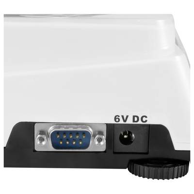 Close-up of a device's rear panel showing a 6V DC power jack and a blue serial connector labeled '6V DC'.