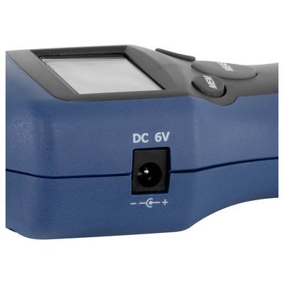 Close-up of a blue handheld device showing a 'DC 6V' power input jack and part of the screen and buttons.<br>
