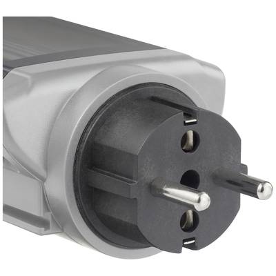 Close-up of a European plug on an electronic device, with two round pins and an earth contact in the foreground.