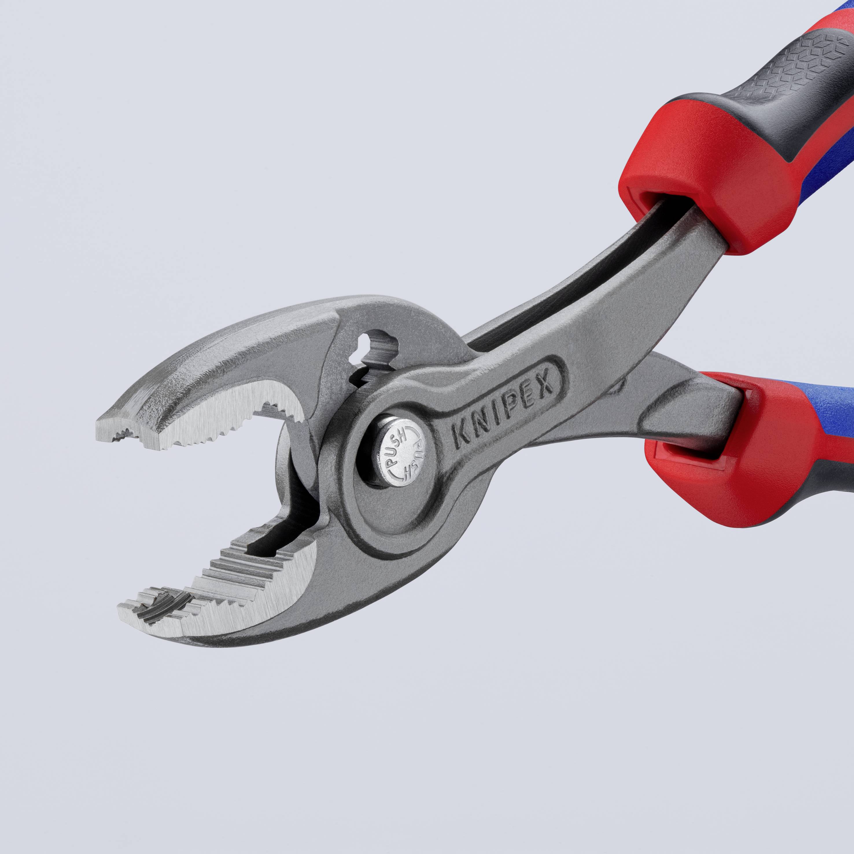 Grey water pump pliers with a red handle, Knipex brand, against a grey background. Tool for gripping and turning objects.