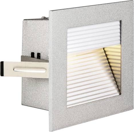 Recessed light fitting with a square silver frame and ribbed diffuser, emitting warm light.