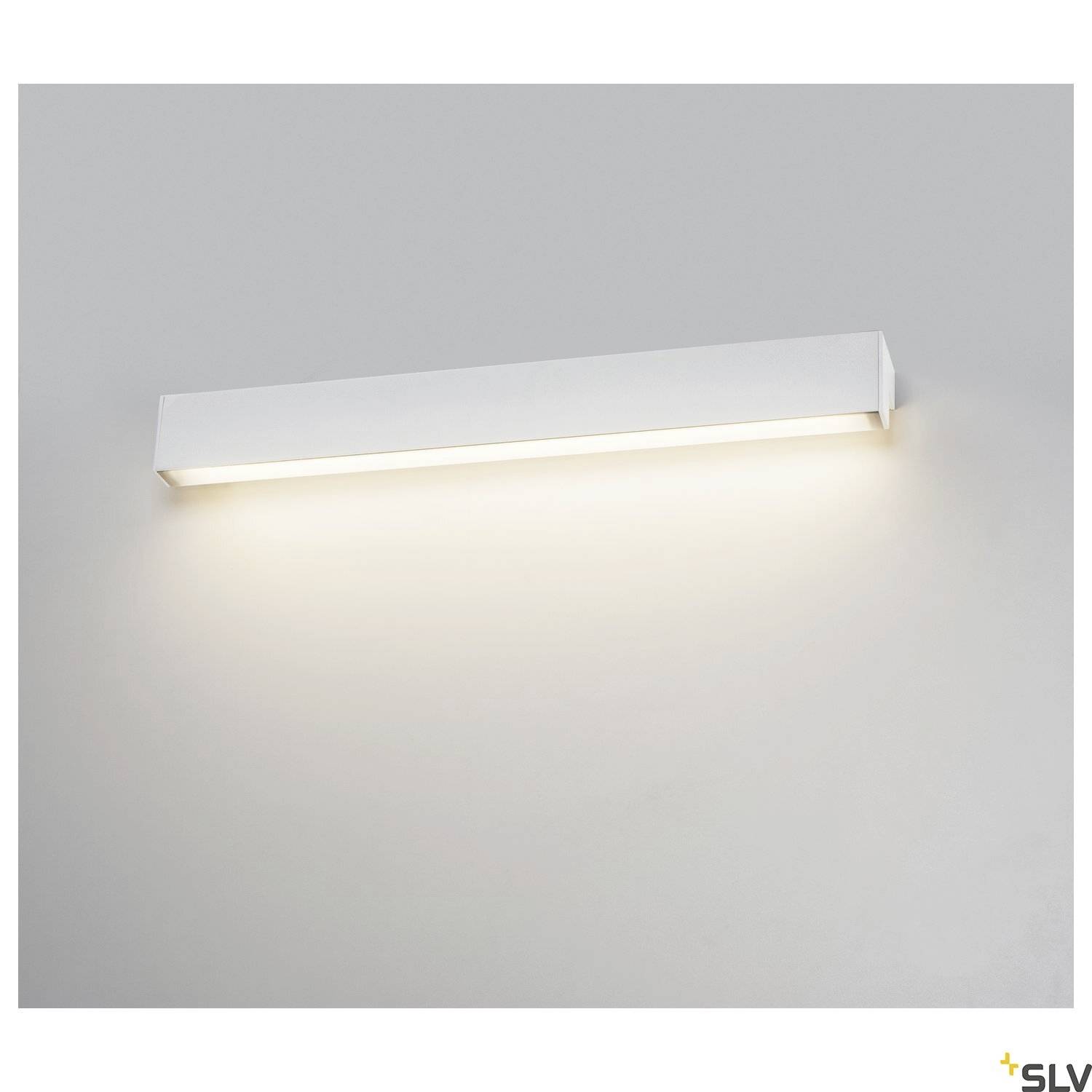 White, rectangular LED wall light illuminates against a grey wall, creating a soft glow.
