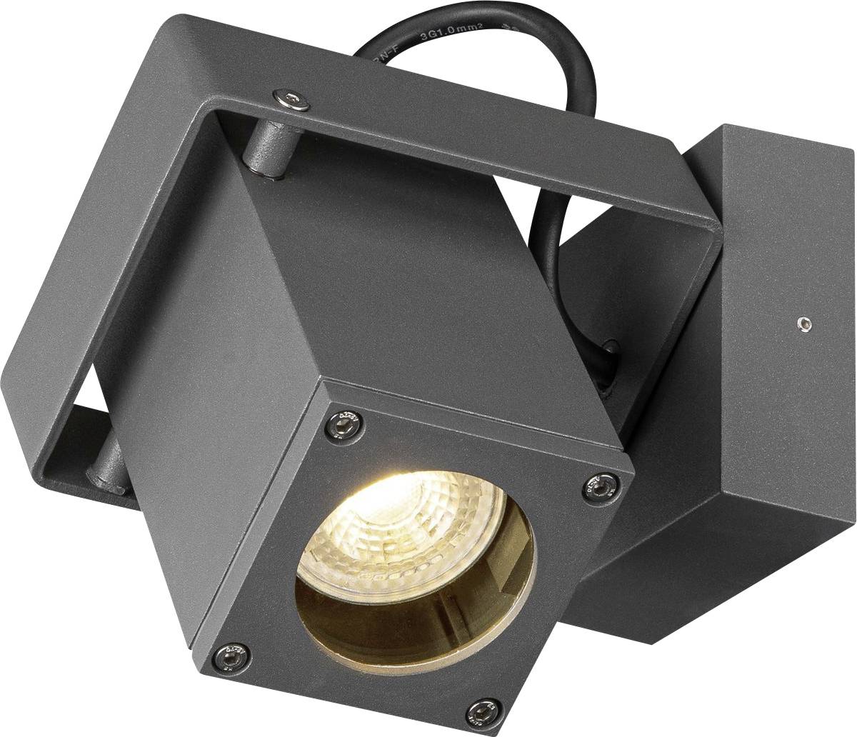 A modern, dark grey LED floodlight with a square casing, mounted on a wall bracket, illuminates in bright yellow.