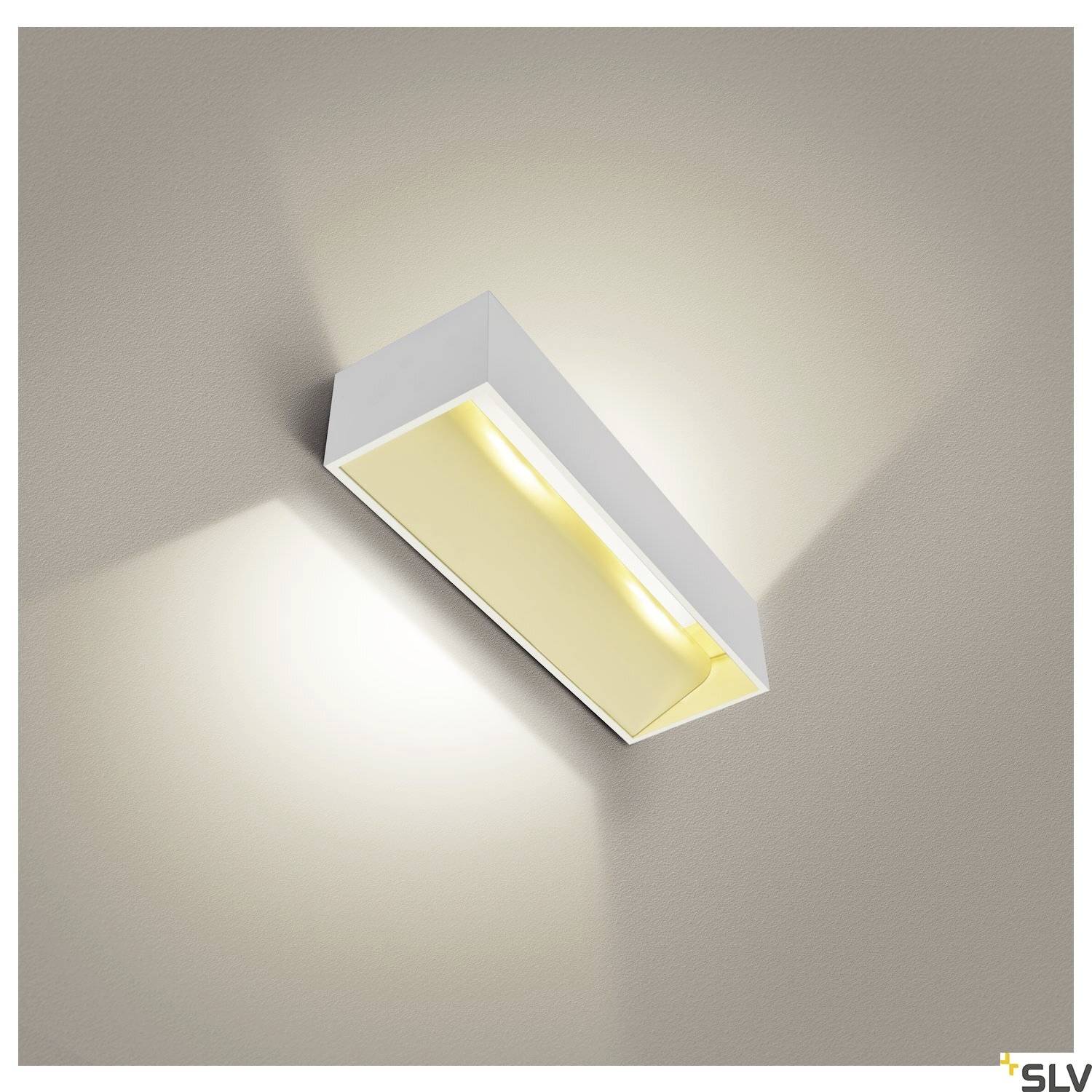 White rectangular wall light that casts soft, warm light upwards and downwards on the wall. Suitable for modern interiors.