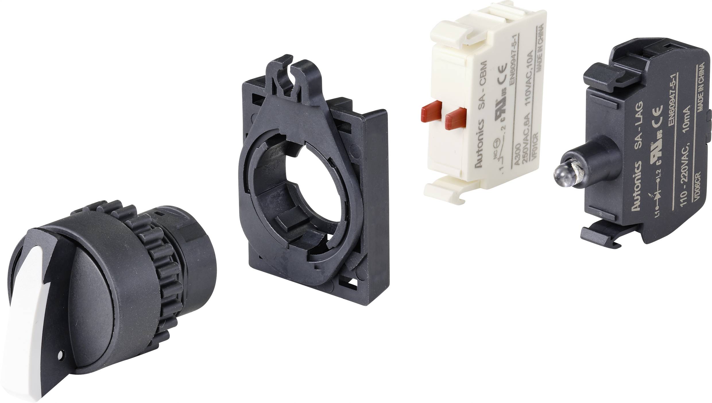 Four parts of a switch system: a rotary knob, a mounting bracket, a white contact block and a black contact with spring.