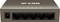 An IP-COM network switch with five Ethernet ports and six LED indicators on the top surface signalling the operational status.