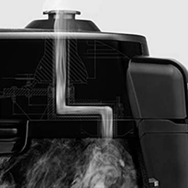 A black and white kettle with steam escaping from the spout. A technical diagram in the background depicts the unit's interior.