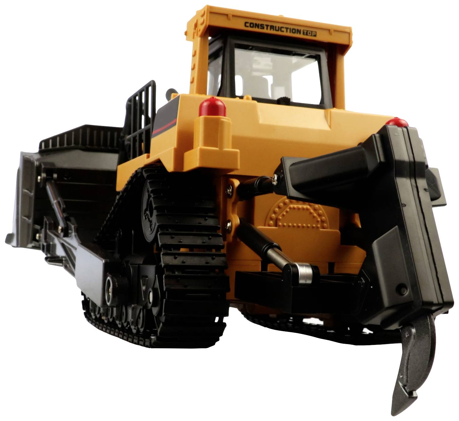A yellow toy bulldozer on a white background. The tracks, shovel and lights are clearly visible.