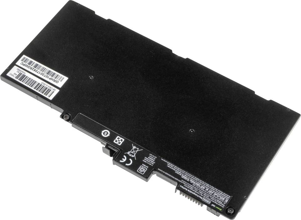 A black laptop battery with labels and connectors lying on a white surface.