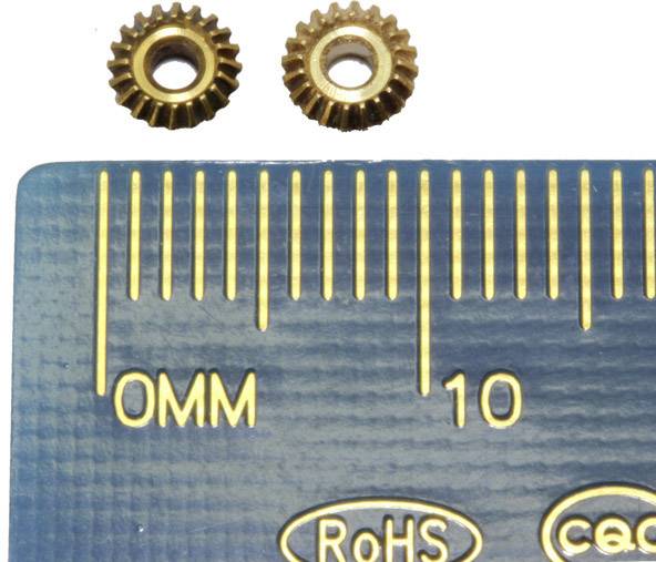 Two small cogwheels next to a ruler with millimetre markings. Text on ruler: 'RoHS', 'ceac'.