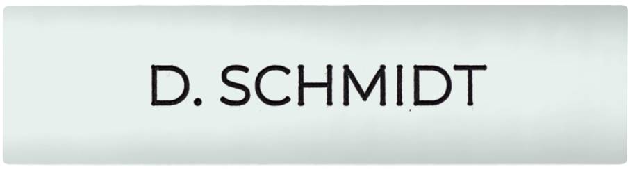 Name badge with the inscription 'D. Schmidt' in black letters on a light grey background.
