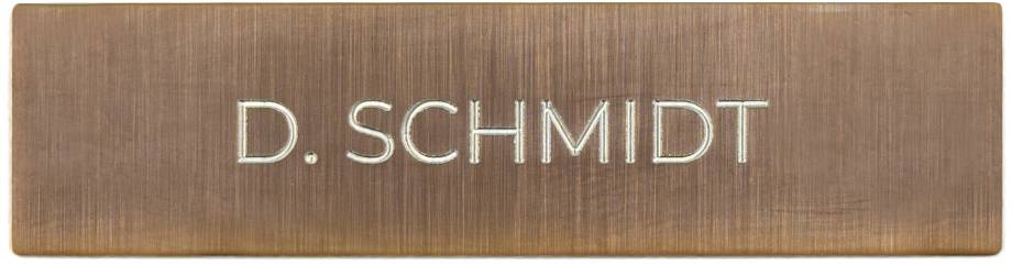 Brass nameplate with engraved name 'D. SCHMIDT'.