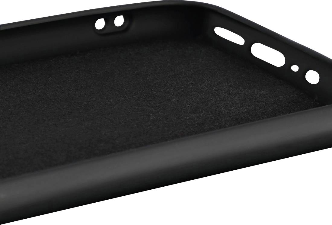 A black plastic tablet edge with several oval and round holes.