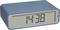 Digital alarm clock with a blue casing shows the time as 14:38. A daylight symbol is visible next to the time.