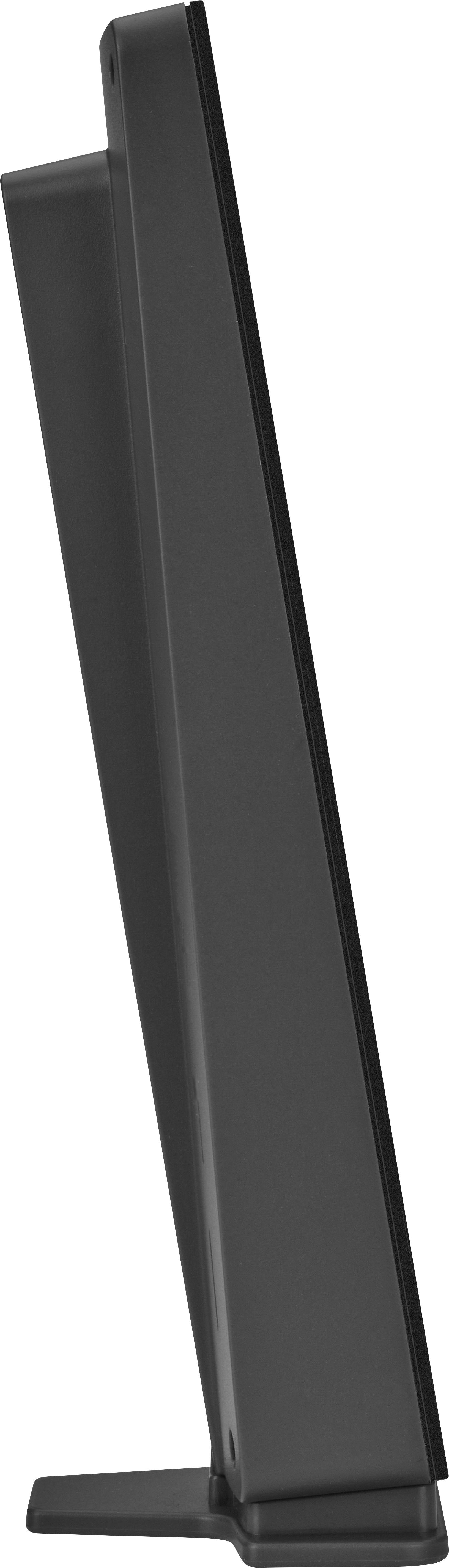 A black rectangular object stands upright with a narrow base, viewed from the side.