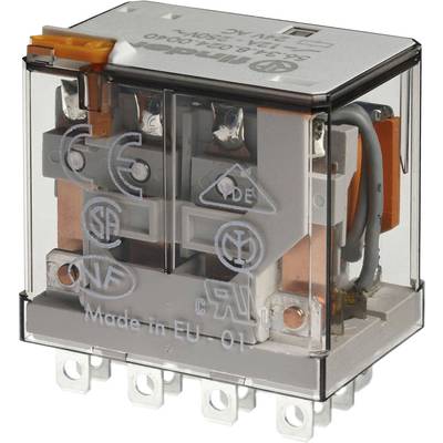 A transparent, electric relay switch with silver contacts and markings; 'Made in EU' is written on the casing.