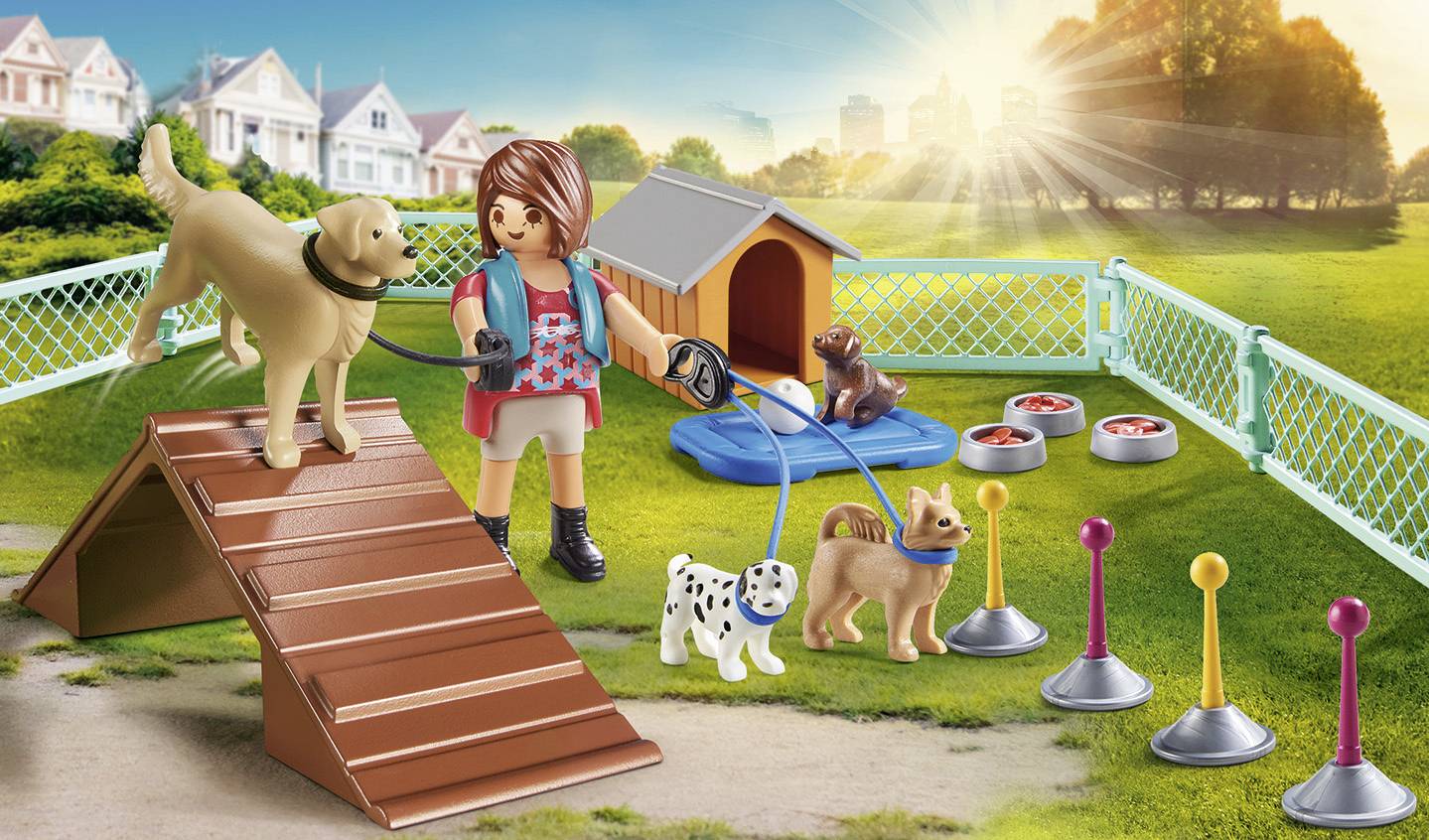 A game character is walking several dogs on a playground. One dog is standing on a ramp, with food bowls visible in the background.
