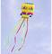 A colourful squid-shaped kite hovers in the blue sky with long, vibrant ribbons fluttering in the wind.
