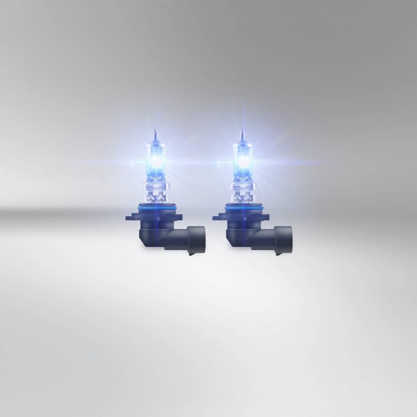Two car halogen lamps light up blue on a grey background, demonstrating their brightness and luminosity.