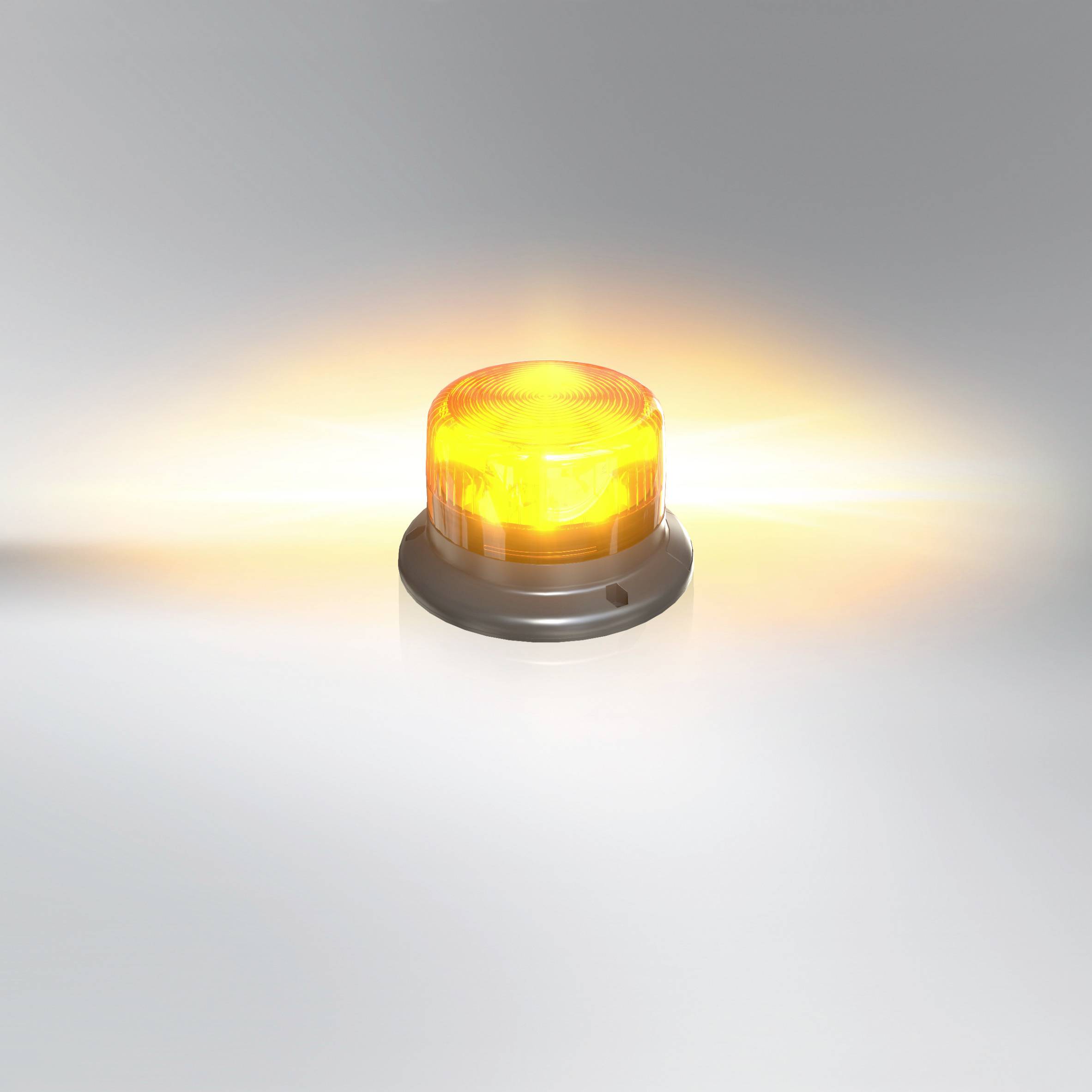 A round yellow warning light illuminates against a grey background. It signals caution or danger, without further context.