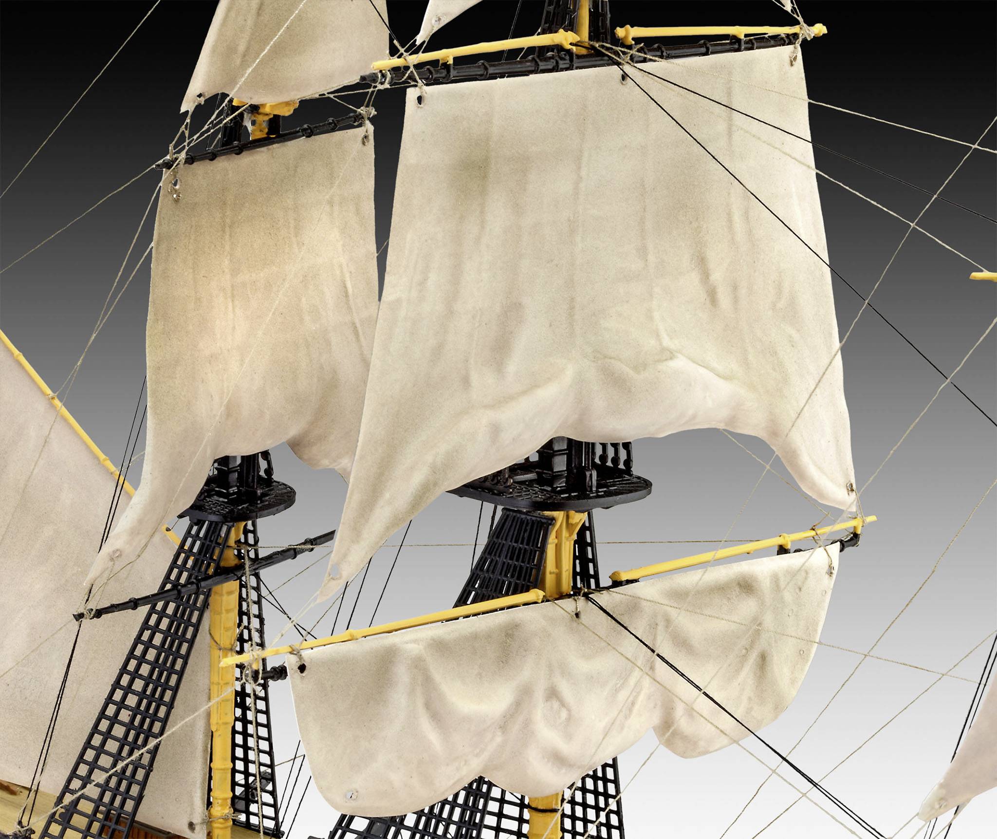 Model of a historical sailing ship with detailed masts and sails, showcasing maritime craftsmanship and historical ship designs.