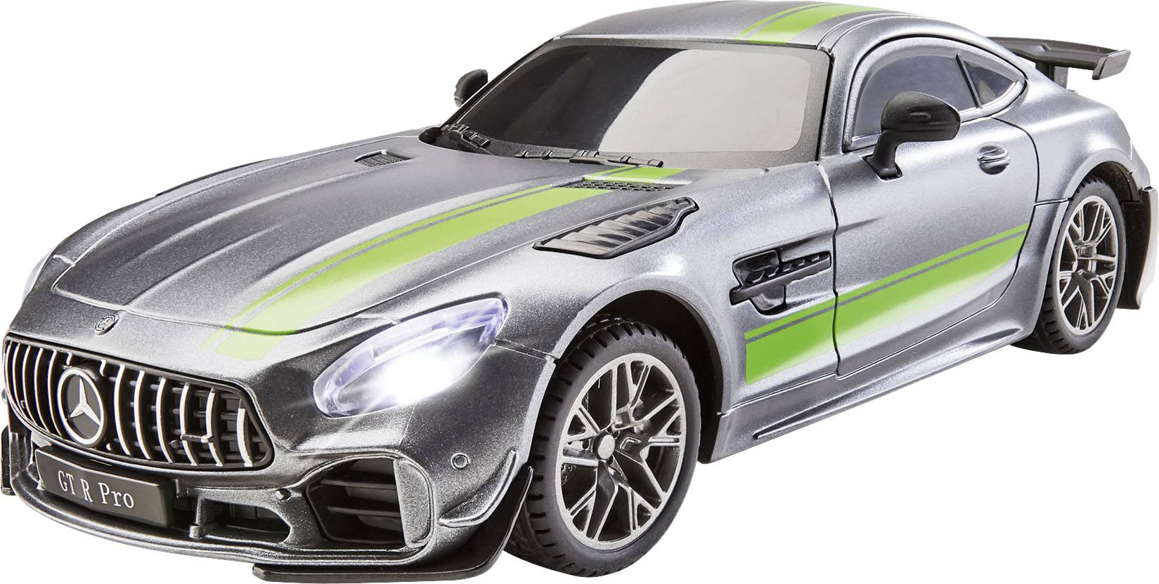 Silver toy sports car with green stripes, visible radiator grille and wheel details, positioned on a smooth surface.