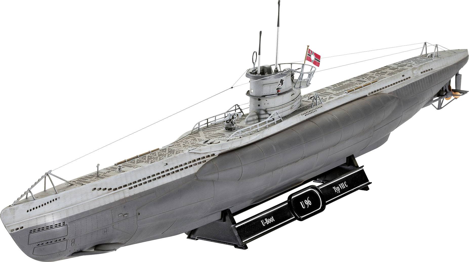 A model of a submarine with a flag, mounted on a black base. Detailed replica with conning tower, periscope and deck.