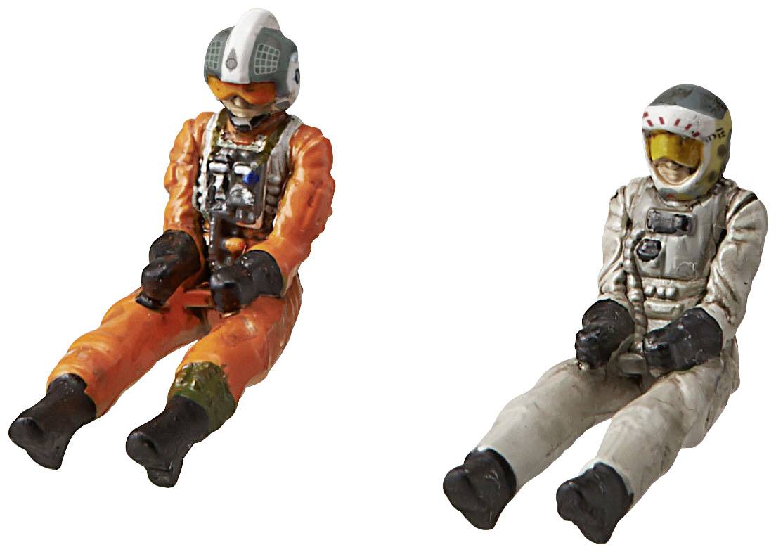 Two detailed figurines in spacesuits against a light background. One is wearing an orange suit, the other a white suit.
