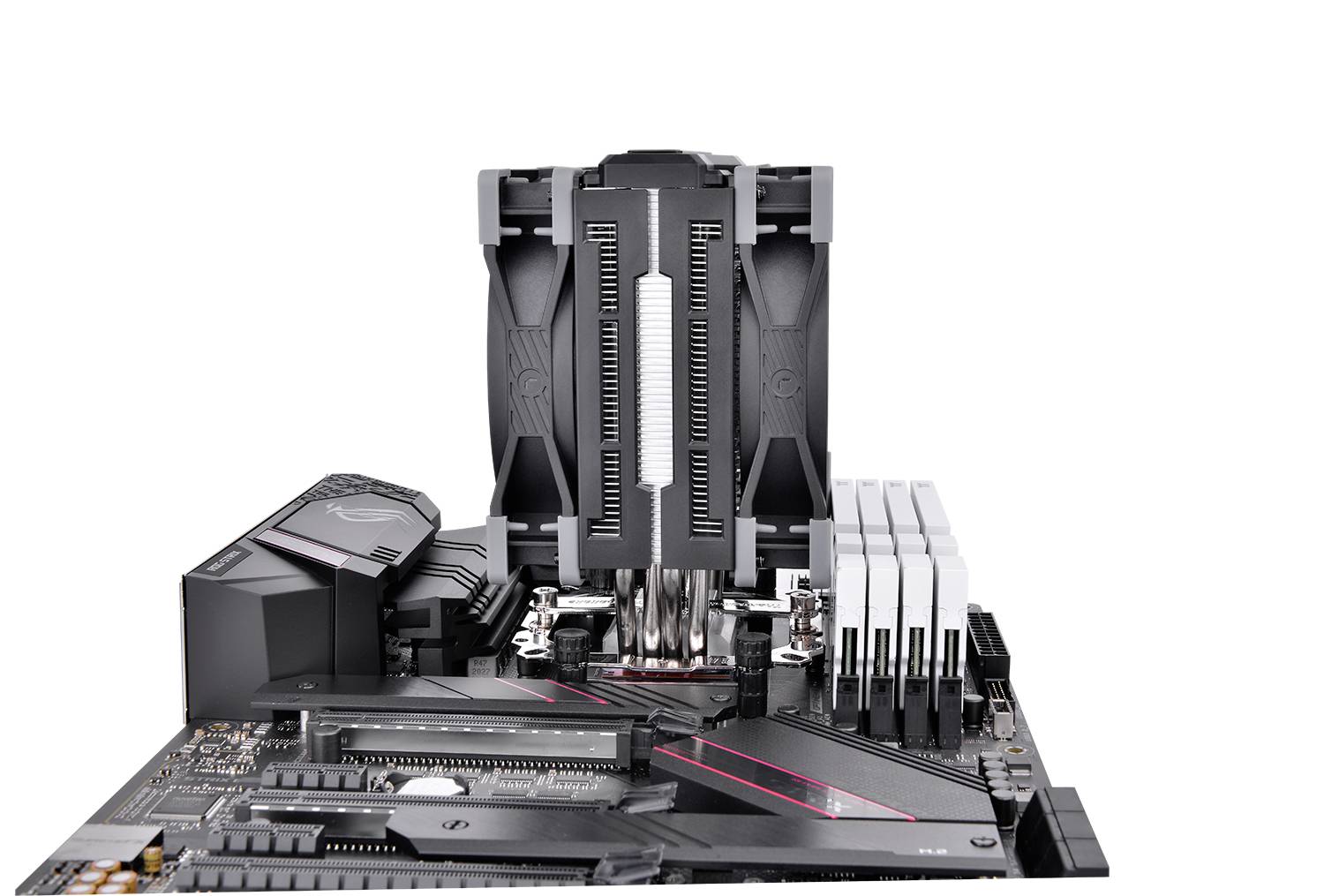 A computer motherboard is visible, equipped with a large CPU cooler and four RAM modules.