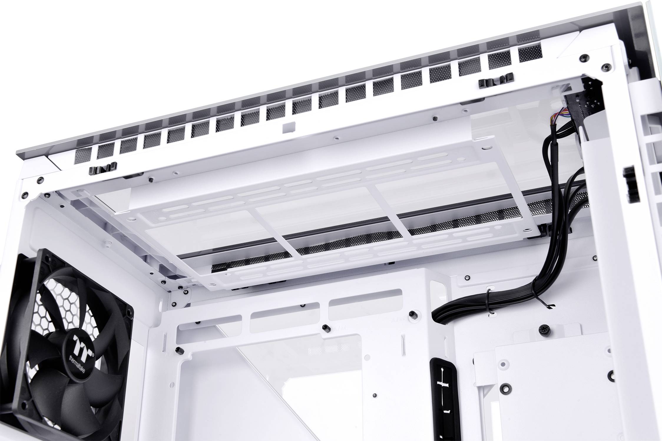 Interior view of a white computer case with visible fans and cables; shows space and arrangement of components.