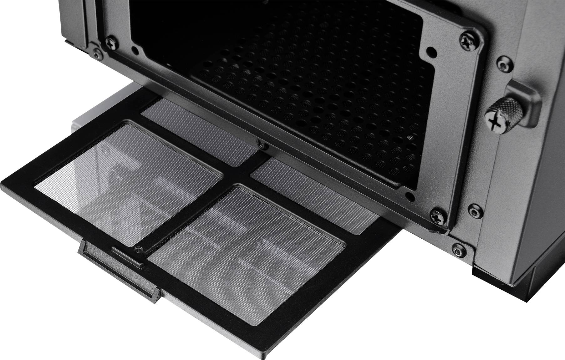 Opened computer casing with extracted dust filter at the bottom, which catches dust and is easy to clean.