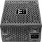 Black and grey computer power supply unit with ventilation slots, switch, and power connection. A brand logo is positioned on the top.