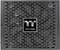 A computer power supply with a fan grille and 'Thermaltake' logo in the centre.