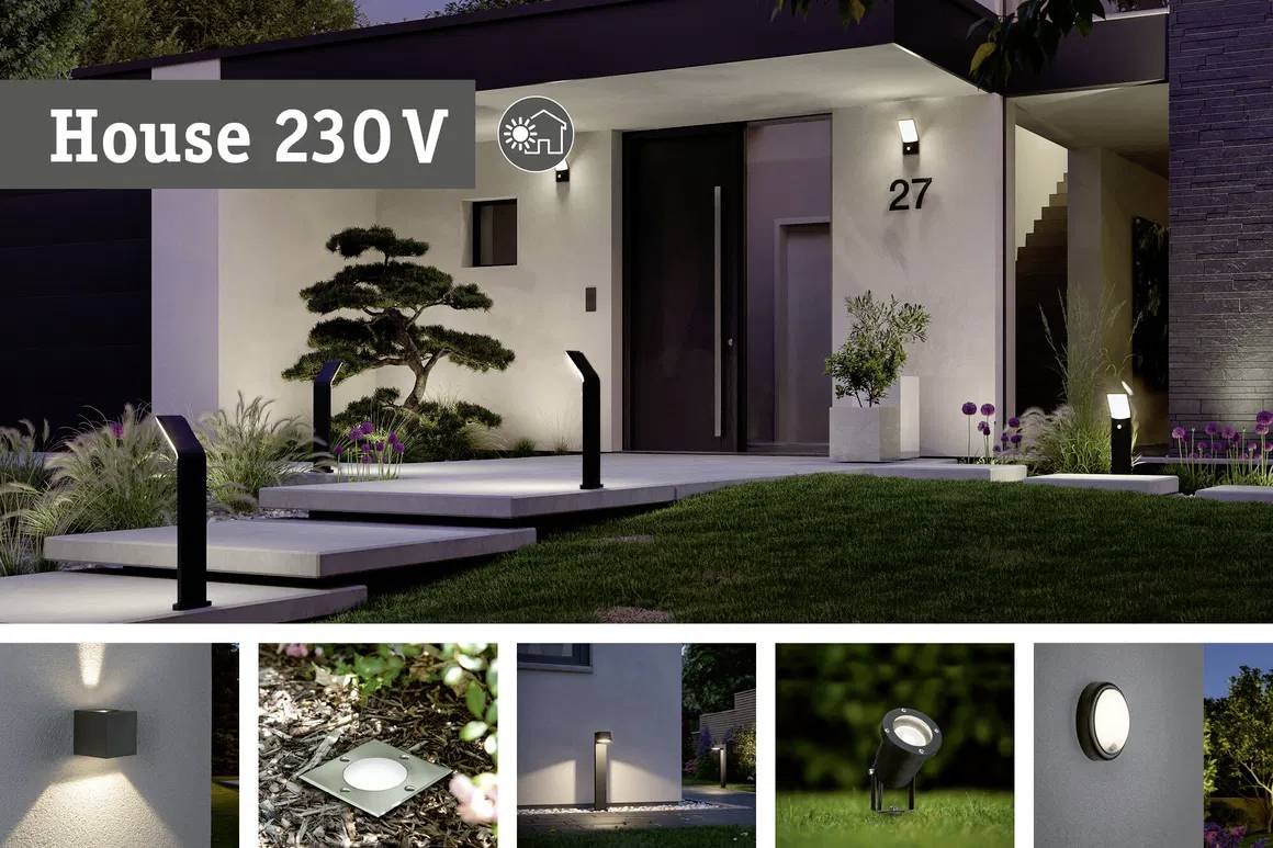 Modern exterior lighting at night on a residential house. Various lamp models for illuminating pathways and garden areas.