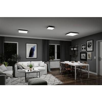 Living room with grey walls, white sofas and a dining table. Modern ceiling lights illuminate the space, stylish artworks adorning the walls.