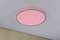 A round ceiling light emits a warm, red glow. It is installed against a white ceiling and a beige wall.