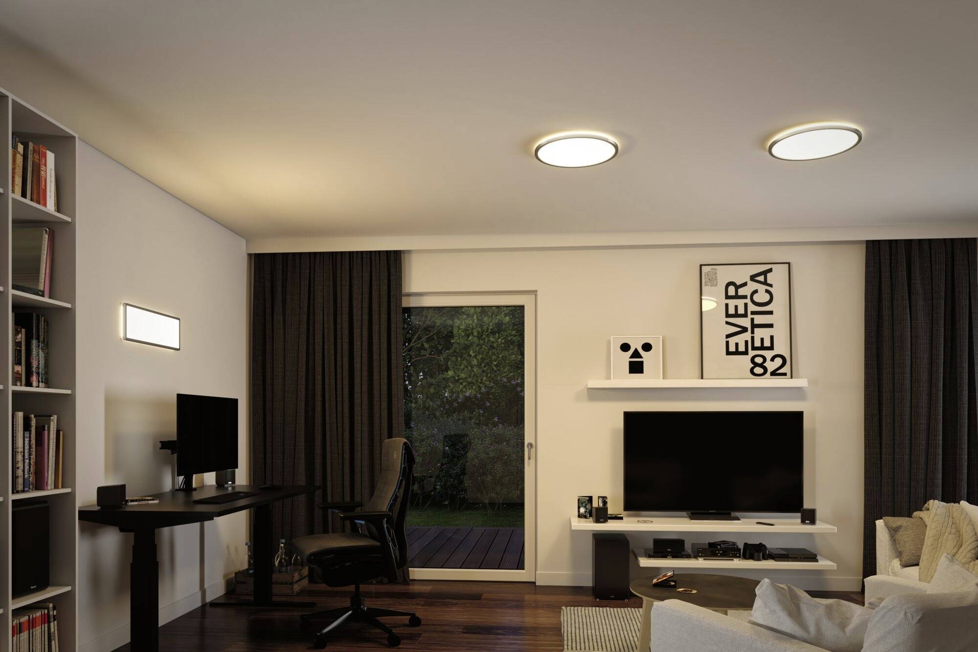 A modern living room with a desk, computer, bookshelf filled with books and a sofa. A picture hangs on the wall with the inscription 'EVER 82 ETICA'.